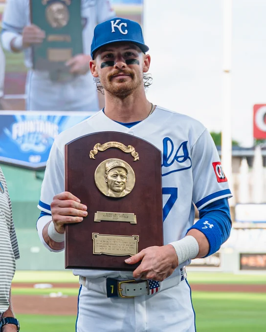 Bobby Witt Jr. holds his 2025 Lou Gehrig Award at Kauffman Stadium. (Photo by Amy Kontras/Major League Baseball)