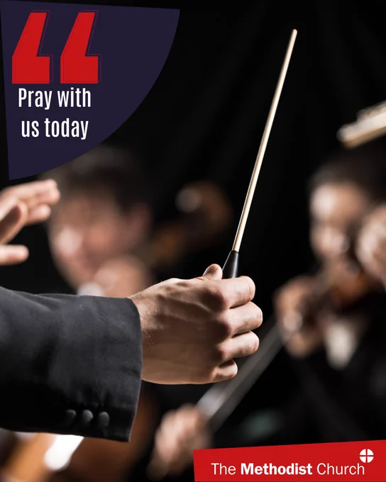 Photo of a conductor holding a baton. Methodist logo in the lower right corner and text which reads 'pray with us today' in the upper left. 