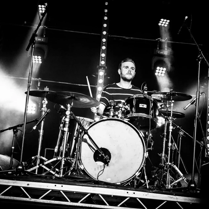 Man playing drums on a stage 