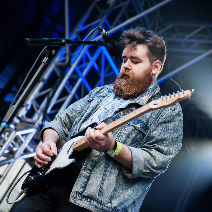 Man playing guitar on stage