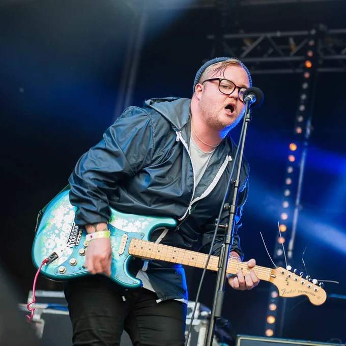 Man playing guitar on a stage