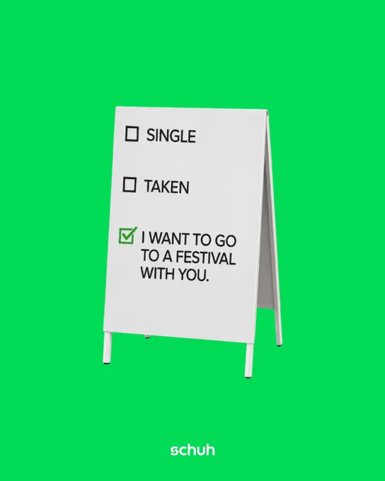 An image of a white A board with text boxes saying "single", "taken", and "I want to go to a festival with you" sitting against a green background.