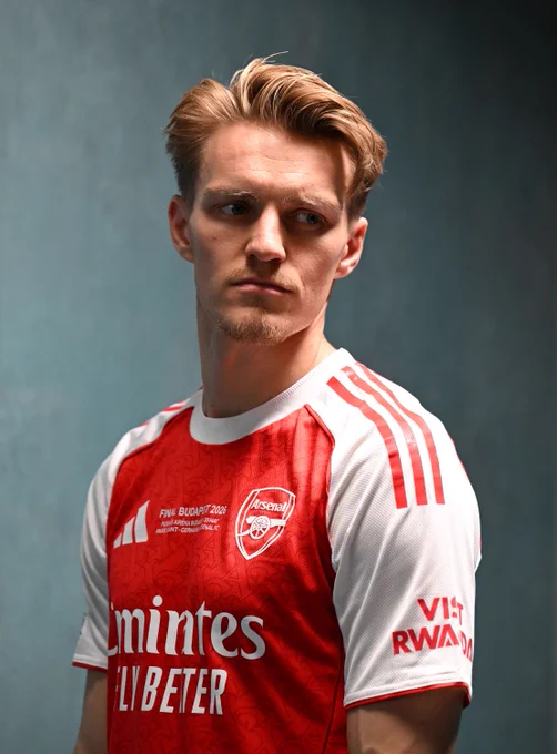 Martin Odegaard wearing Arsenal's Champions League final shirt for a photoshoot 