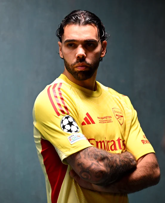 David Raya wearing Arsenal's Champions League final goalkeeper shirt for a photoshoot 