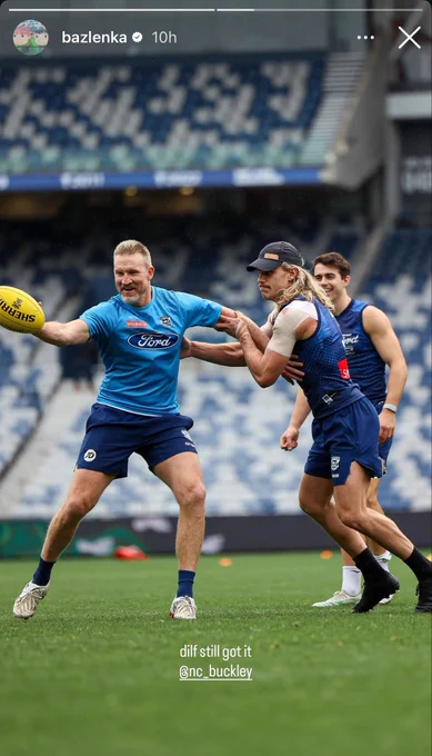 Photo from Instagram of Bailey smith and Nathan Buckley at footy training with his own caption “dilf still got it”