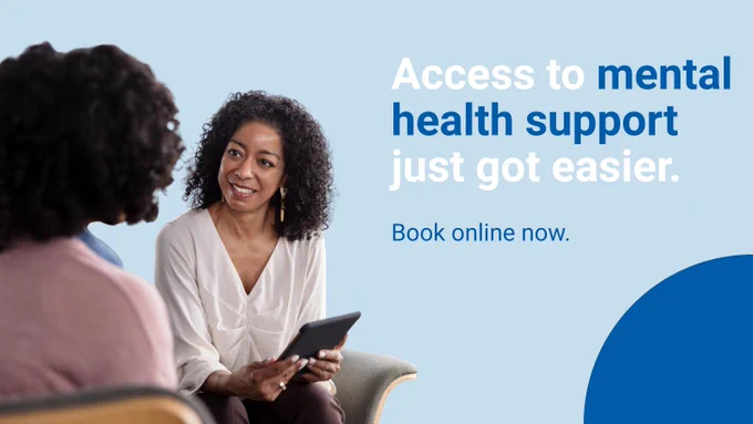 Two woman sit and talk, a caption reads "Access to mental health support just got easier. Book online now."