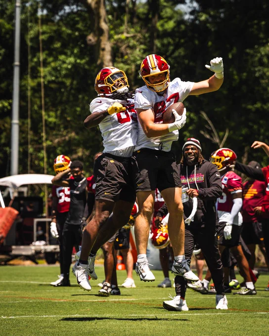 Photo of Chig Okonkwo and John Bates celebrating after a play.