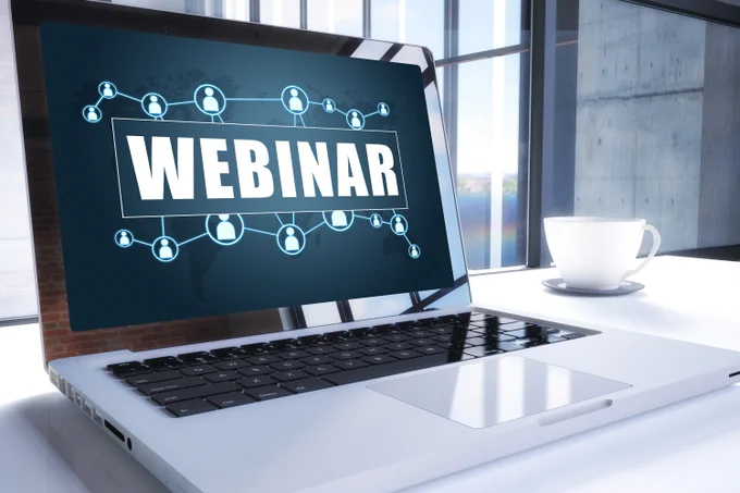The word, webinar, on a laptop screen.