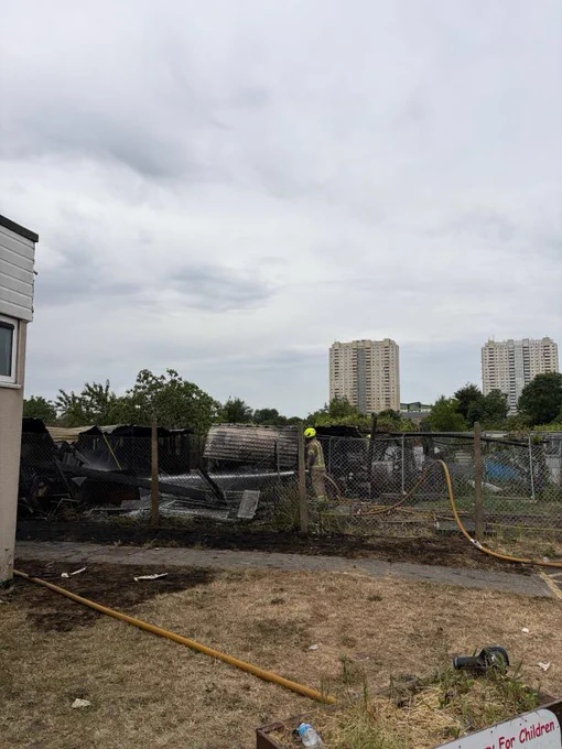 A firefighter putting out a fire on the Edmonton allotment