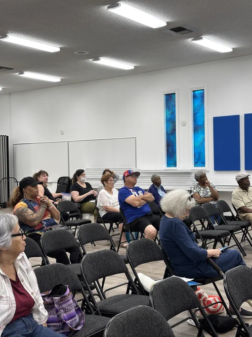 constituents sitting and listening to mayor 