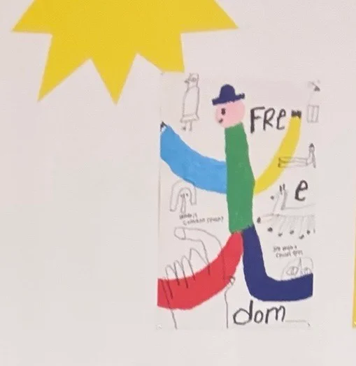 A child's drawing with letters spelling out "Freedom"