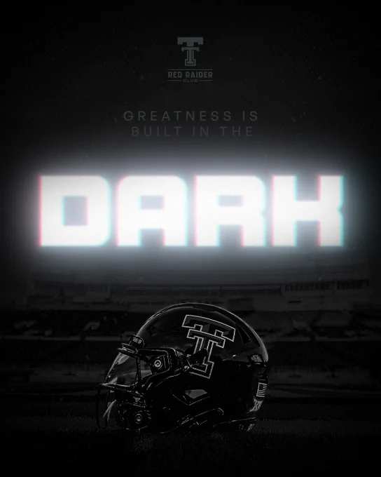 Texas Tech black football helmet on a dark field with glowing text "Greatness Is Built in the Dark" and the Red Raider Club logo