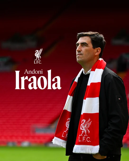 A picture of Andoni Iraola wearing a Liverpool scarf at Anfield
