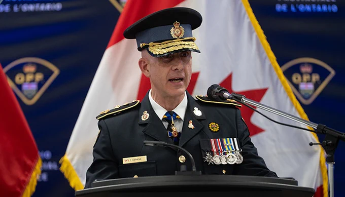 OPP Commissioner Thomas Carrique delivers remarks at a podium
