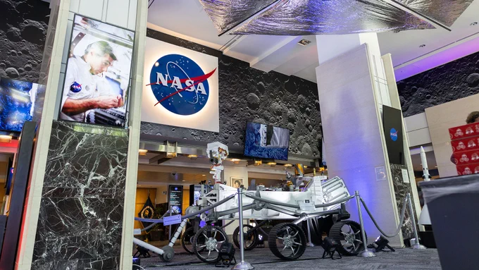 The lobby at NASA's Headquarters has been redesigned to feature artifacts, interactive exhibits, a replica mars rover, and a donut shop in Washington, DC. (NASA/Tiffany Coutris)