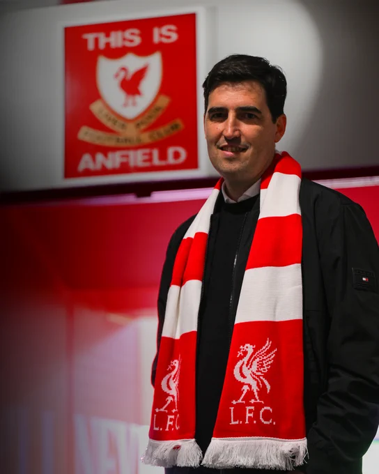 A picture of Andoni Iraola at Anfield in front of the 'This is Anfield' sign