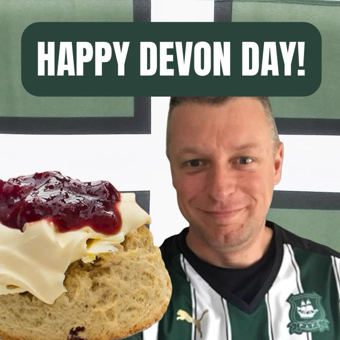 Devon day picture of me, the Devon flag and a scone