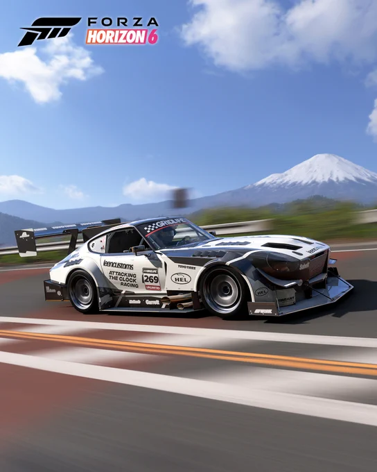 The 1972 Datsun #269 Attacking the Clock Racing 240Z ‘All Carbon Hill Climb Beast’ driving fast along a road in Forza Horizon 6. Mt Fuji can be seen in the background.