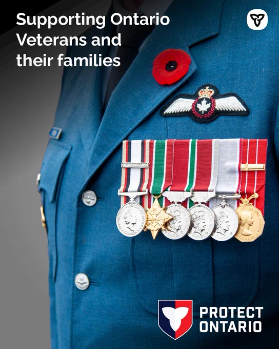 Closeup of Canadian veteran in uniform with poppy and medals 