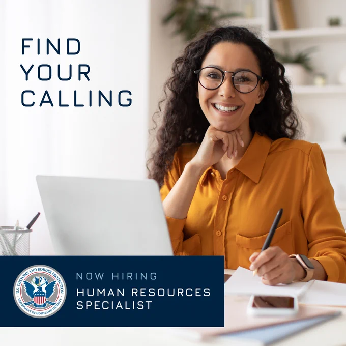 Professional woman working at a desk with a laptop. Text reads, find your calling. Now hiring a Human Resources Specialist.