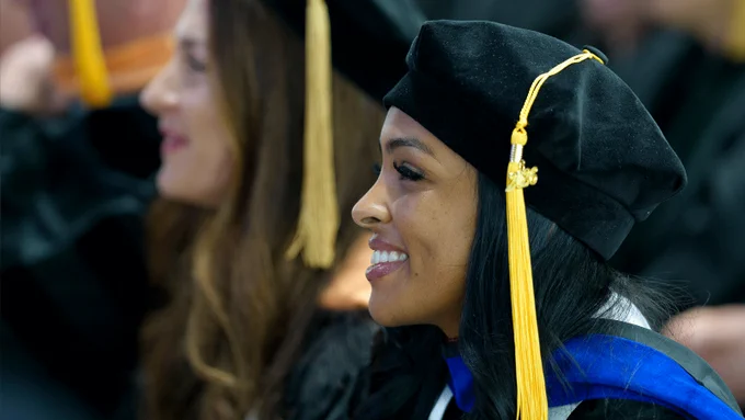UMass Chan PhD graduates, with 2026 on tassel visibel