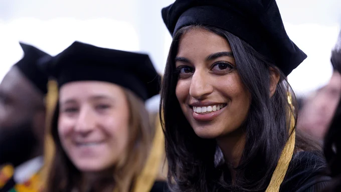 Graduates smiling for the camera