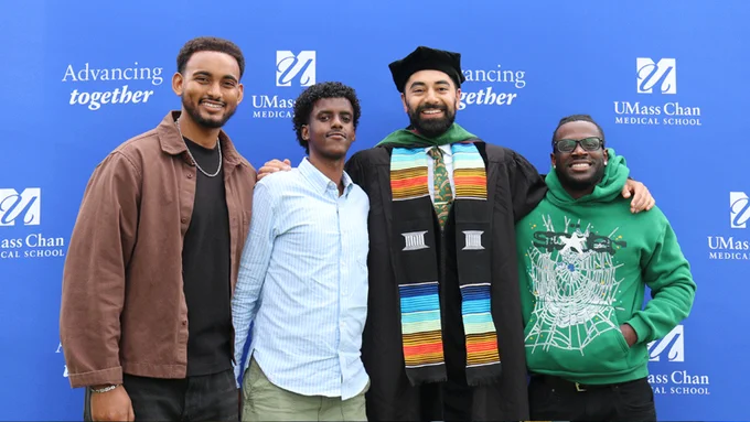 Graduated medical student poses in the photo booth