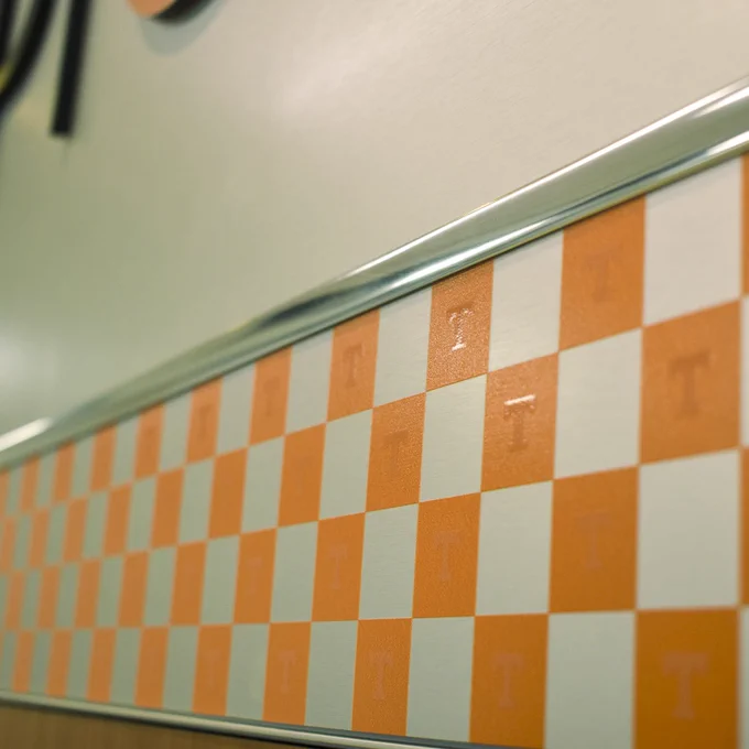 A close up of Power Ts inside the checkerboard design of the VolShop sign.