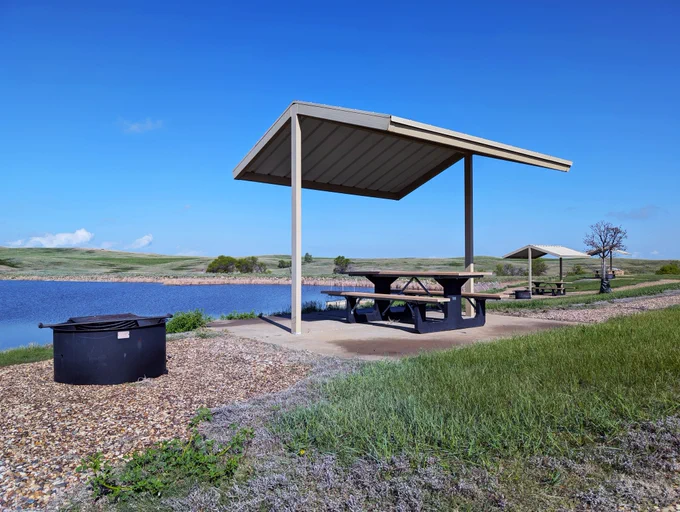 The Blacktail Picnic Area includes three covered picnic tables on a concrete pad and a fire grill. Visitors should check current fire restrictions by reviewing the Alerts and Fire Danger Information at the top of the Forest Service website. USDA Forest Service photo by Scott C. Marvin.