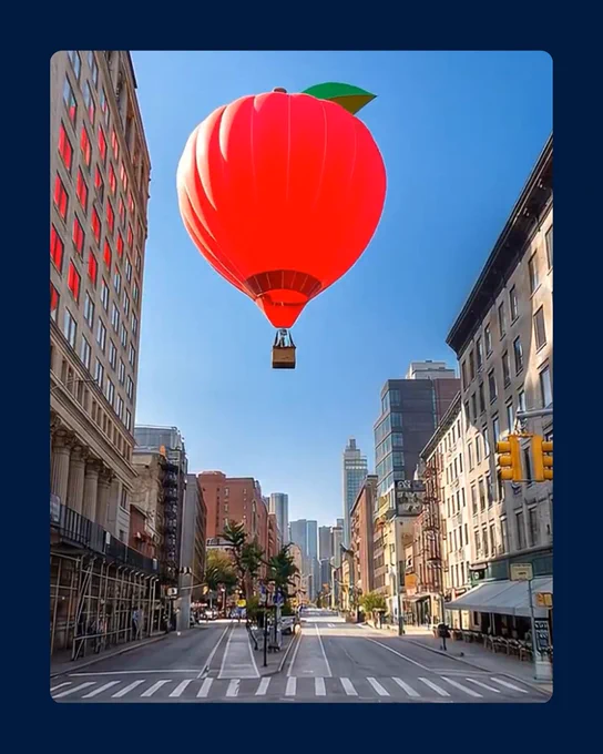 A hot air balloon floats above a city street.