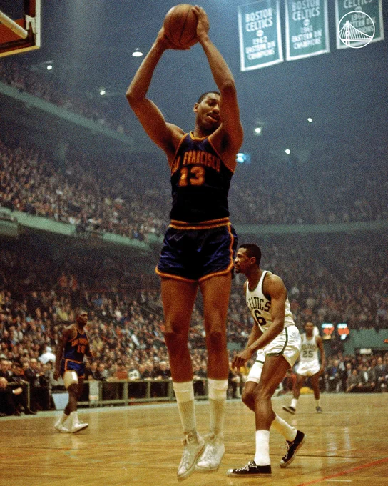 Photo of Wilt Chamberlain securing a rebound in 1963