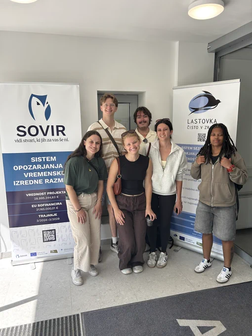CIROH Water-R20 NRT students stand with colleagues at Slovenia's Environment Agency during their international study tour visit.