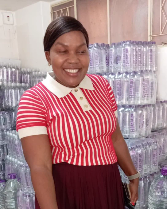 Photo of Thembeka from Pietermaritzburg collecting her Designer Water pH10 from the Master Distributor in the area.