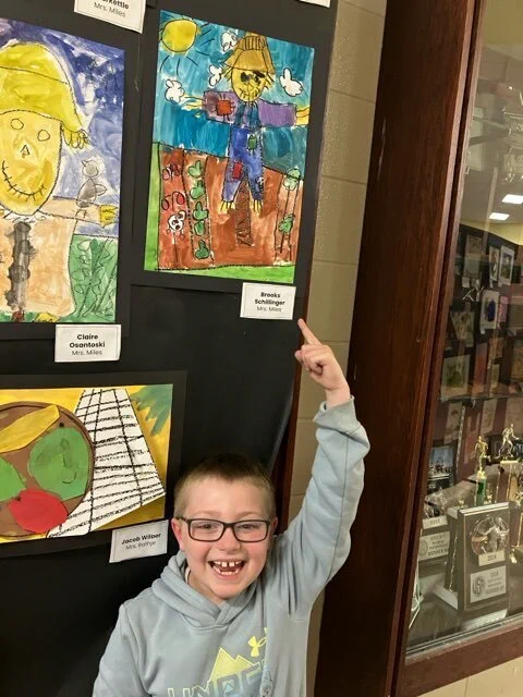 Students in Mrs. Miles' Class enjoy viewing art at the 2026 Fine Arts Night. 