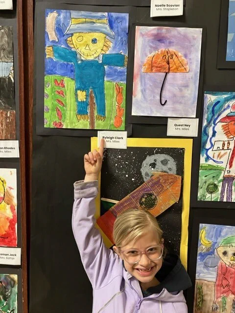 Students in Mrs. Miles' Class enjoy viewing art at the 2026 Fine Arts Night. 