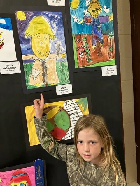 Students in Mrs. Miles' Class enjoy viewing art at the 2026 Fine Arts Night. 