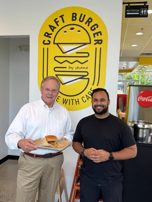 Jeff Patterson of the SBA enjoys a burger at Craft Burger By Shane in celebration of National Burger Day