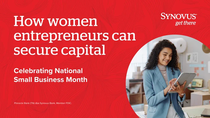 The image features a person wearing a suit, smiling, and using a tablet. The background contains shelves with books and office items. Text on the image reads, "How women entrepreneurs can secure capital," and "Celebrating National Small Business Month." The Synovus logo is present at the top right corner.