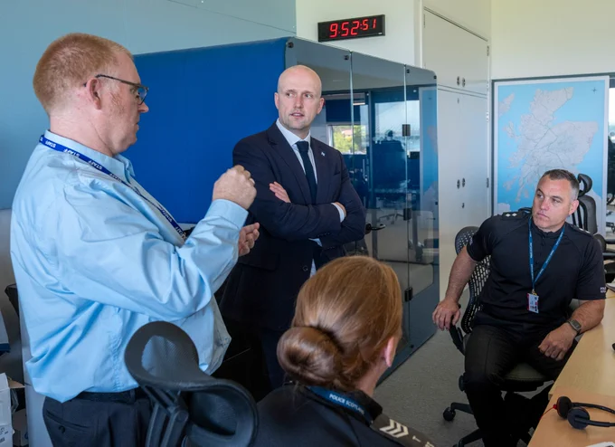 Transport Secretary Stephen Flynn talks to resilience staff at the Traffic Scotland National Control Centre.