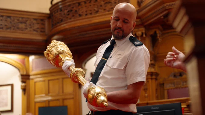 Official usher with gold mace