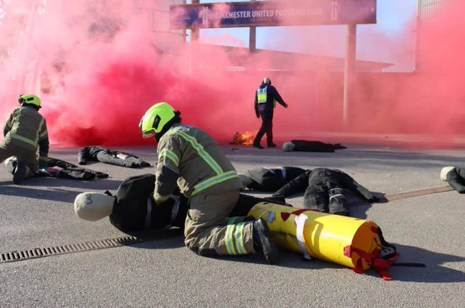A firefighter performing a 'rescue' at a training exercise.