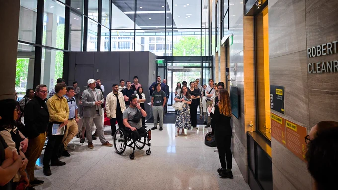 A group of people gather at MIT.nano.