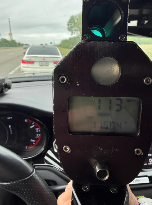 A radar, on a Patrol car dashboard, shows 105 mph. 