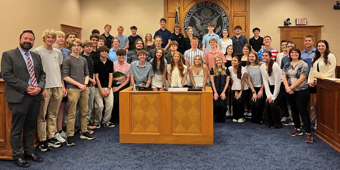 Students gather around U.S. District Judge Judith Levy at the federal courthouse.
