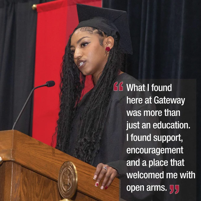 Graduate in cap and gown delivering a speech at a podium with a red and black backdrop during a ceremony, with the quote that says What I found here at Gateway was more than just an education. I found support, encouragement and a place that welcomed me with open arms. 