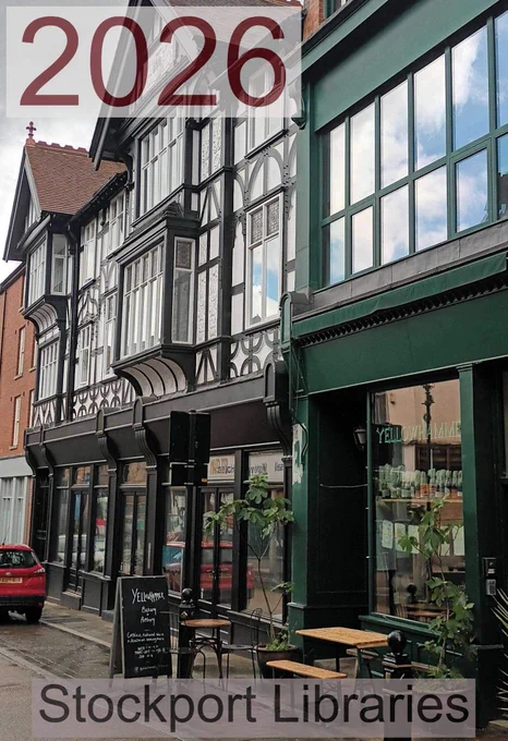 Street view of a shopping street with traditional and modern buildings, featuring a bakery and pottery studio.