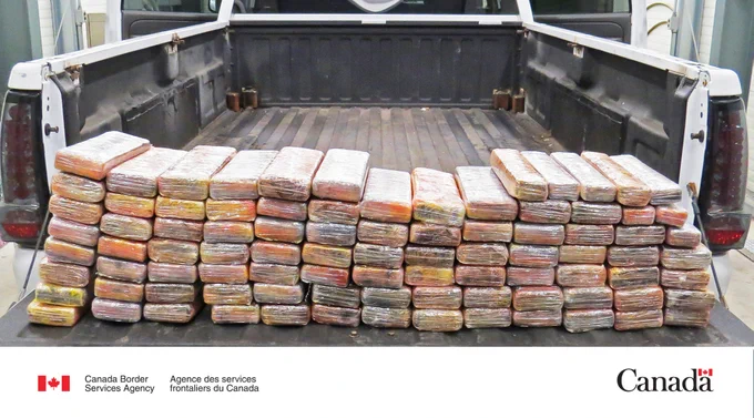 Bricks of cocaine on a pickup truck bed.