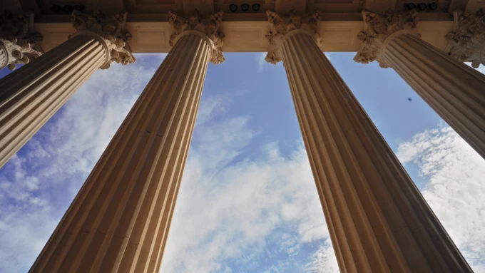 A skyward look at the pillars of Dallas Hall on the campus of SMU.