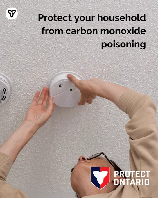 Person changing an alarm. Text: Protect your household from carbon monoxide poisoning 