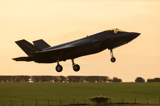 An RAF Lightning taking off in the sunset.